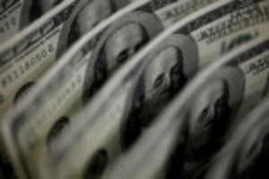 Picture of Dollar on course for weekly gain; kiwi leaps with inflation