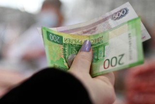 Russian rouble stronger in thin offshore trade