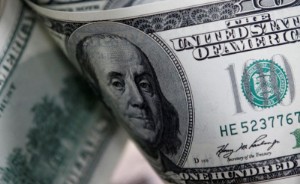 Picture of Dollar loses ground after Fed raises rates, forecasts more hikes