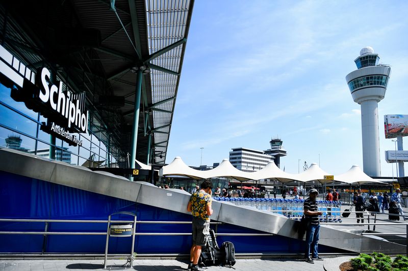 Schiphol Airport says passenger caps to continue through October