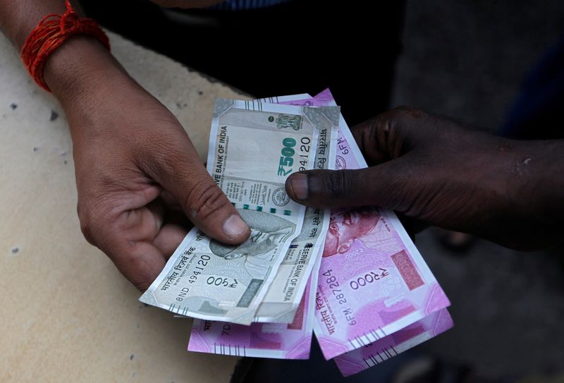 Indian rupee set to trade near historic low in coming three months - Reuters Poll