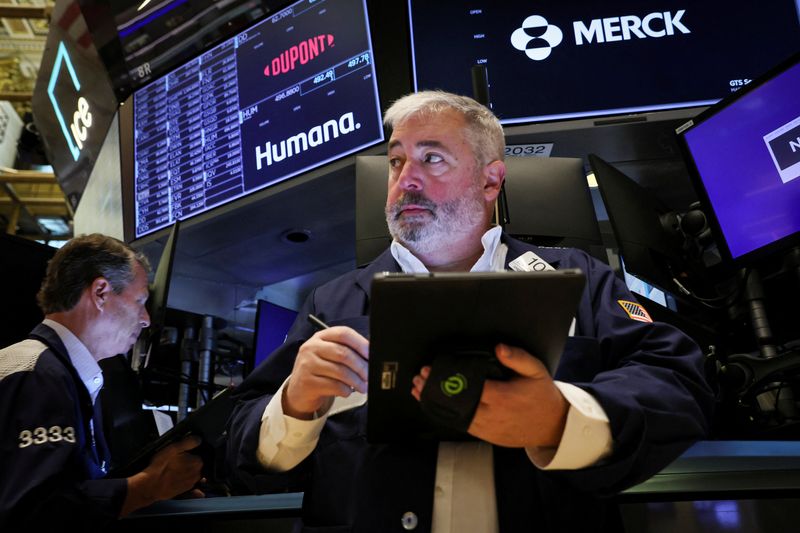 Wall Street ends down, but indexes volatile following Fed minutes