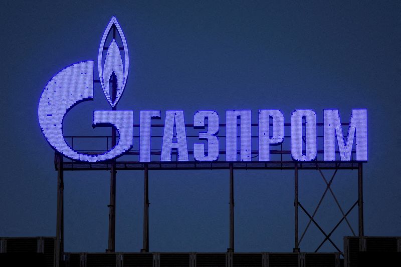 Russian stocks climb as Gazprom surges on dividend promise; rouble slips