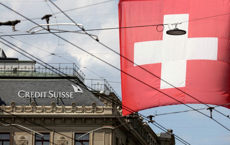Credit Suisse shares hit record low after report bank is looking to raise cash