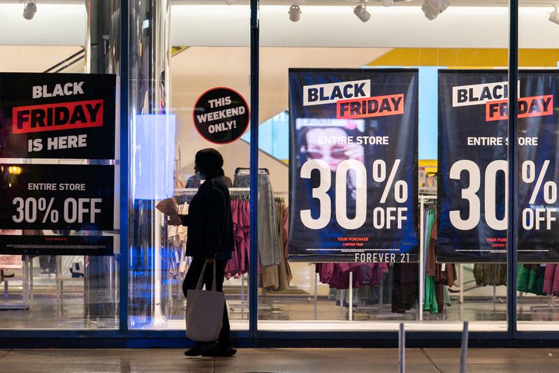 More Black Friday shoppers return to stores, chasing deals