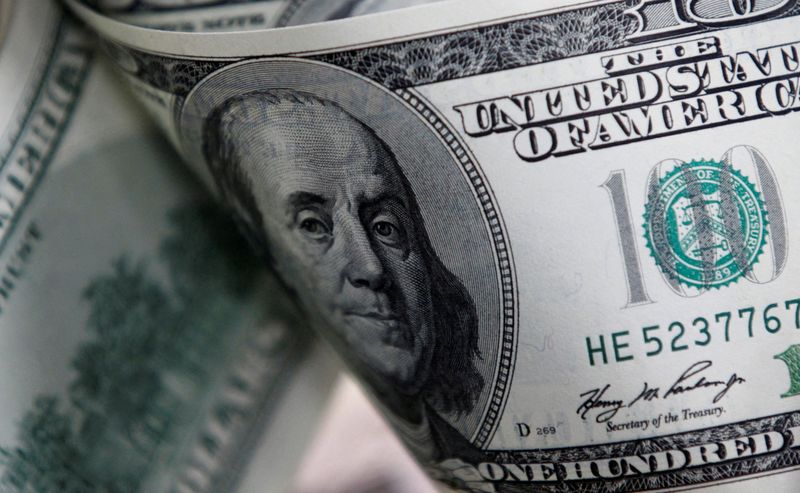 Dollar edges up, investors weigh outlooks for rates and economy