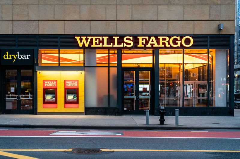 Wells Fargo profit falls 50% on higher reserves, costs