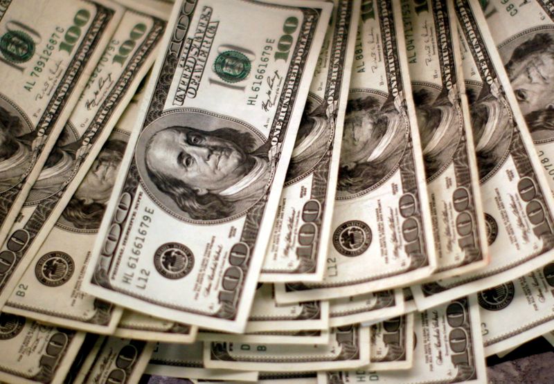 Dollar flat to slightly up as investors cautious ahead of U.S. payrolls