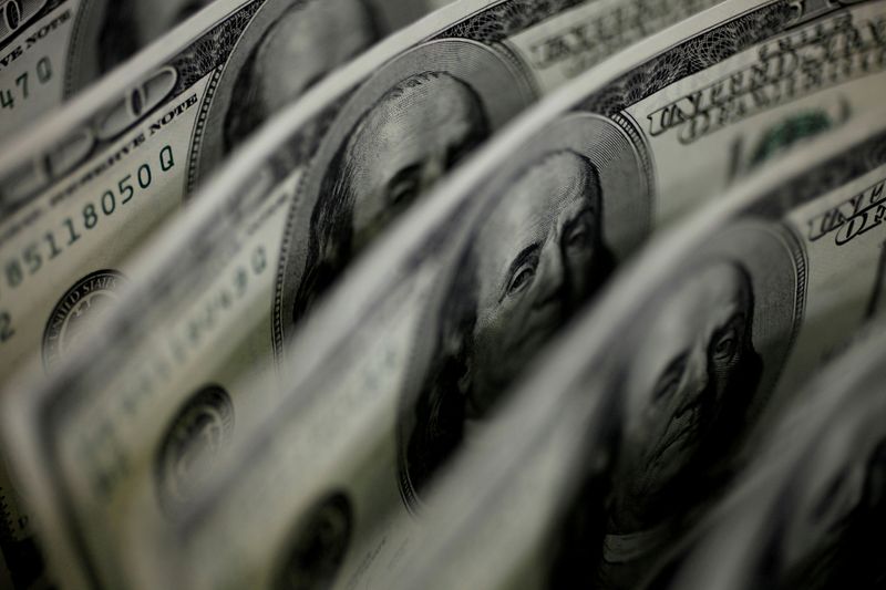 Dollar ends week strong on upbeat U.S. retail sales data