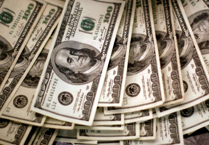 Dollar gains with yields as Fed policy in focus
