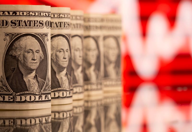 Dollar touches three-week high, lifted by recent data, Fed taper view