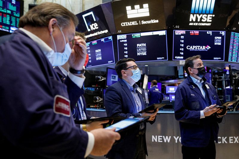 Wall St closes down, Fed speakers put rate hikes in focus